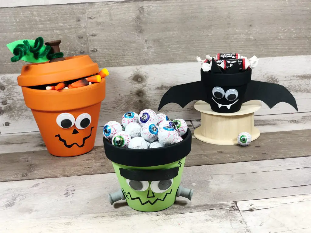 Clay pots made to look like halloween characters